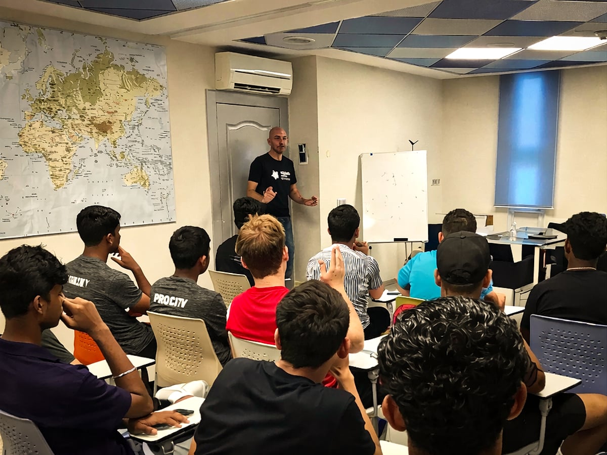 Coach guiding player through tactical movement