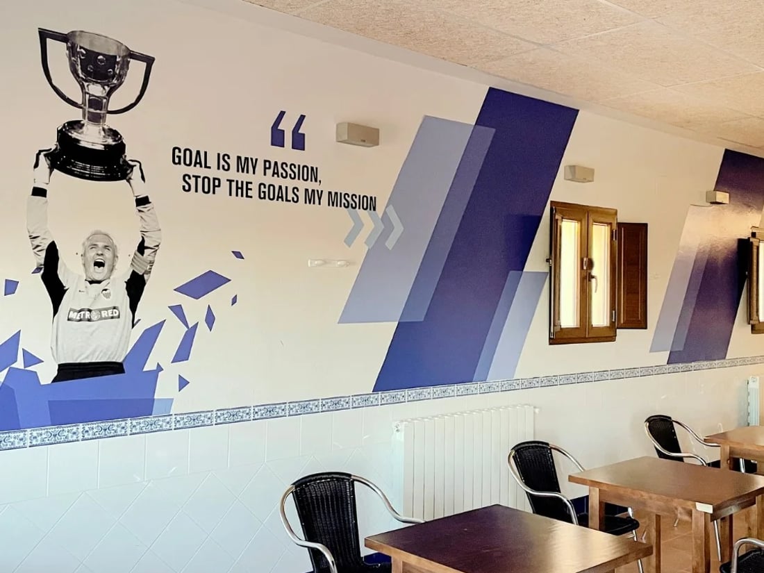 Athlete common room with motivational mural